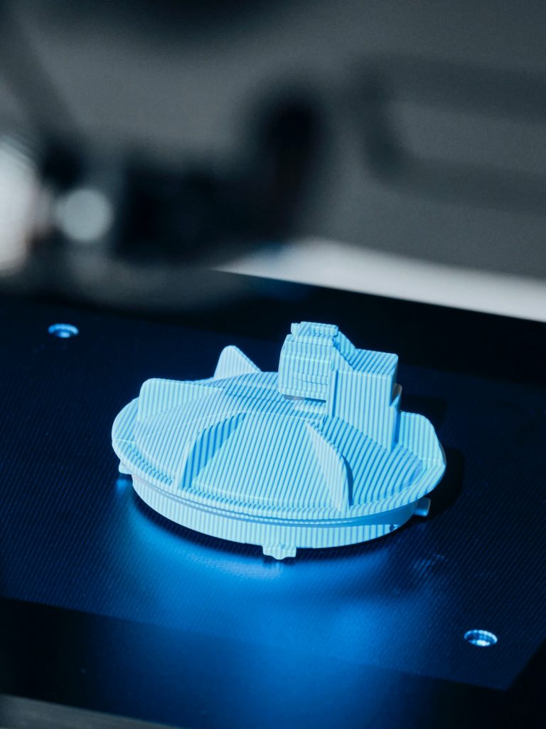 Small plastic part being 3D scanned