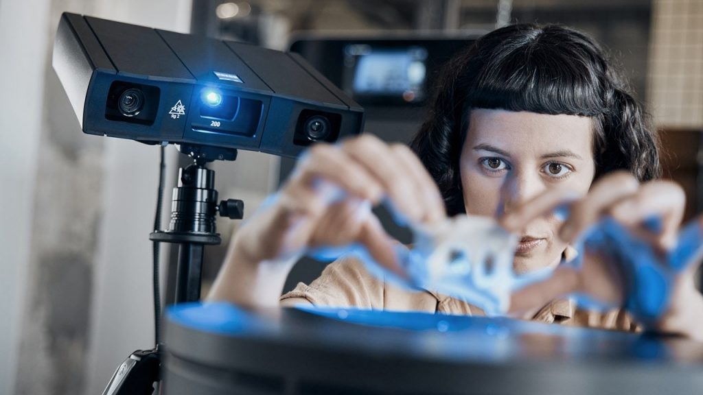 Technicians inspects 3D printed part using GOM Scan 1