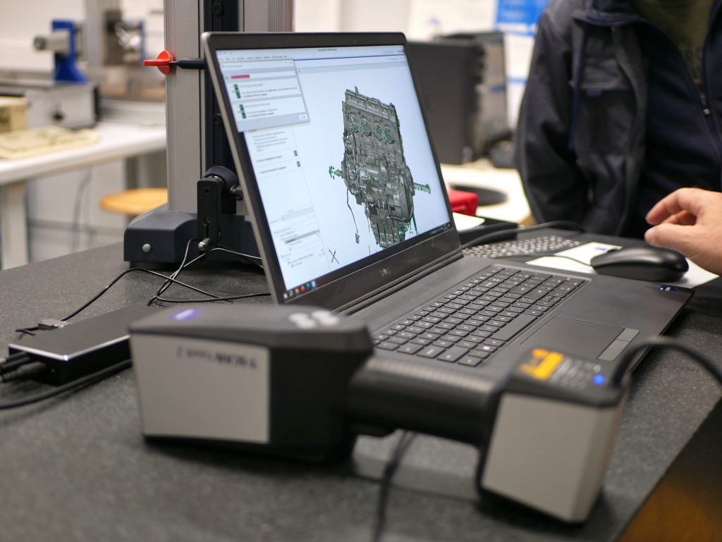 A person evaluating a motor cycle component in the ZEISS INSPECT software